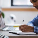 Man writing laptop.